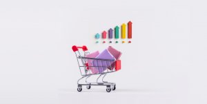 A shopping cart with arrows in front of it, symbolizing the growth and movement of ecommerce statistics.